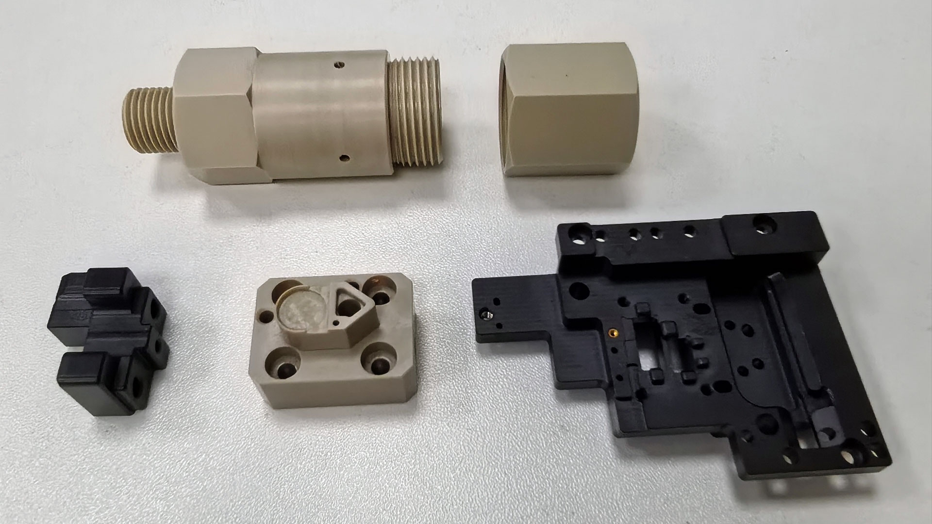 An array of various high-precision finished PEEK parts